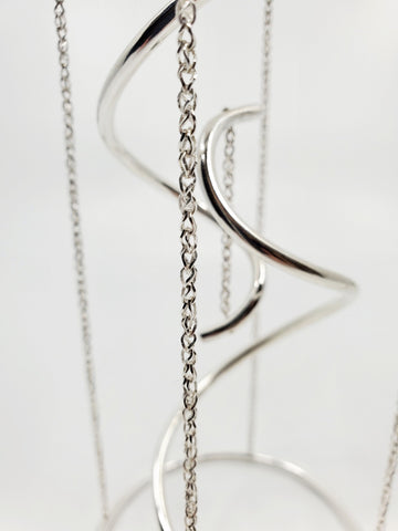 Tensegrity - A kinetic, collapsible, sculpture of sterling silver, with sapphires. 