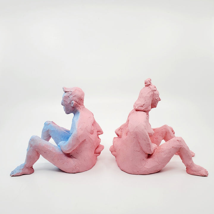 Kiss Me Baby I - small double-sided pink ceramic sculpture painted with gouache. The sculpture is comprised of two sides, one of a figure and the other of a face. - With its counterpart