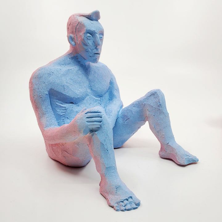 Kiss Me Baby II- small double-sided pink and blue ceramic sculpture painted with gouache. The sculpture is comprised of two sides, one of a figure and the other of a face. 