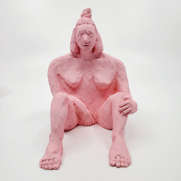 Kiss Me Baby I - small double-sided pink ceramic sculpture painted with gouache. The sculpture is comprised of two sides, one of a figure and the other of a face. 
