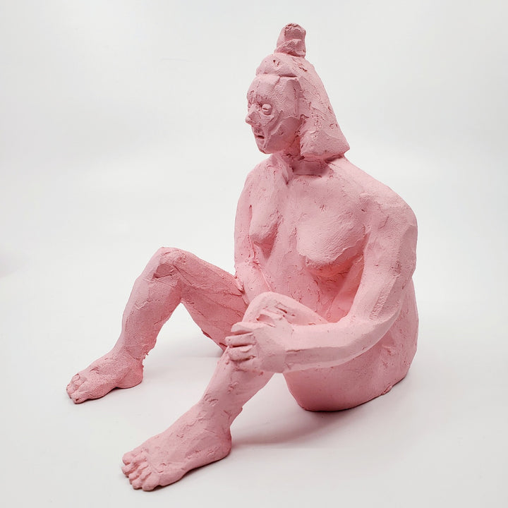 Kiss Me Baby I - small double-sided pink ceramic sculpture painted with gouache. The sculpture is comprised of two sides, one of a figure and the other of a face. 
