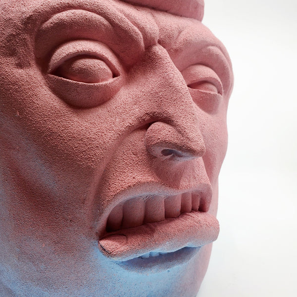 Holding Back II - large ceramic two-sided sculpture of a figure biting a finger, with blue and pink gouache paint.