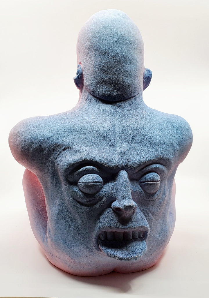 Holding Back I - large ceramic two-sided sculpture of a figure biting their tongue, with blue and pink gouache paint.