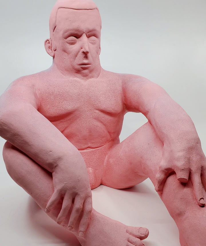 Holding Back I - large ceramic two-sided sculpture of a figure biting their tongue, with blue and pink gouache paint.