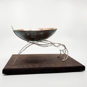 Continuity - "The unbroken and consistent existence." A copper vessel rests atop a sterling silver stand on a wenge wood base.