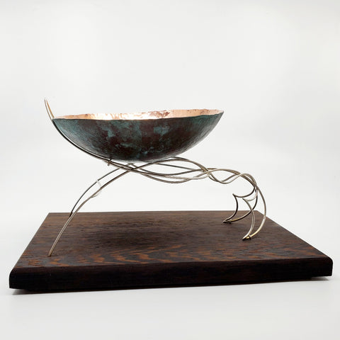 Continuity - "The unbroken and consistent existence." A copper vessel rests atop a sterling silver stand on a wenge wood base.