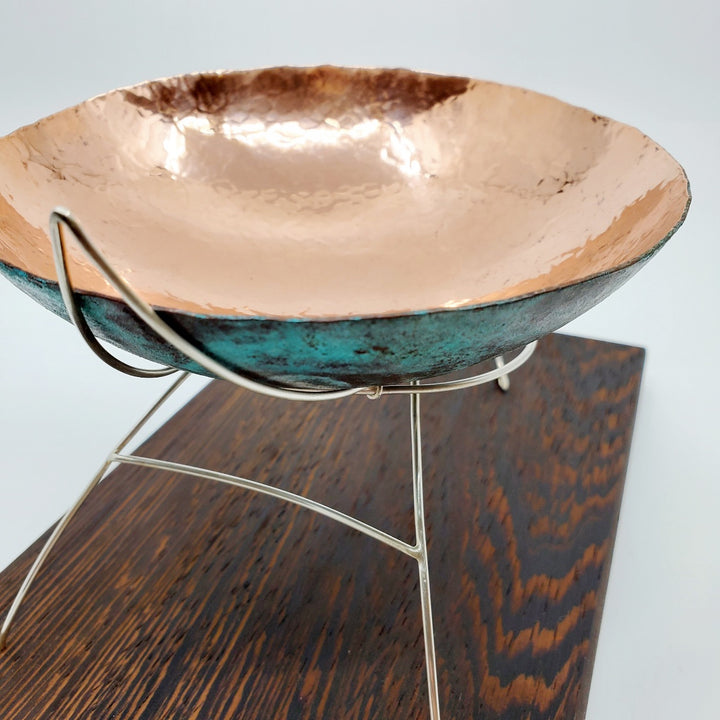 Continuity - "The unbroken and consistent existence." A copper vessel rests atop a sterling silver stand on a wenge wood base.