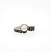 Hand stamped sterling silver ring with a moonstone. 