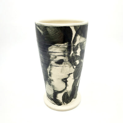 Medium ceramic vessel - 2. Hand painted porcelain vessel. Black glaze has been applied in careful layers to depict faces and patterns. 10 x 10 x 18 cm.