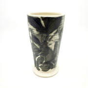 Medium ceramic vessel - 2. Hand painted porcelain vessel. Black glaze has been applied in careful layers to depict faces and patterns. 10 x 10 x 18 cm.
