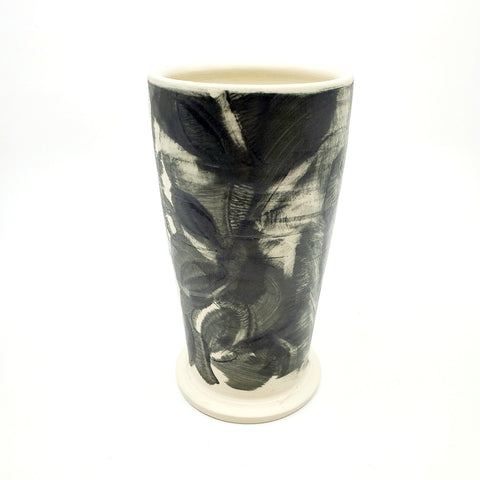 Medium ceramic vessel - 2. Hand painted porcelain vessel. Black glaze has been applied in careful layers to depict faces and patterns. 10 x 10 x 18 cm.