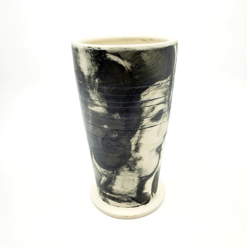 Medium ceramic vessel - 2. Hand painted porcelain vessel. Black glaze has been applied in careful layers to depict faces and patterns. 10 x 10 x 18 cm.