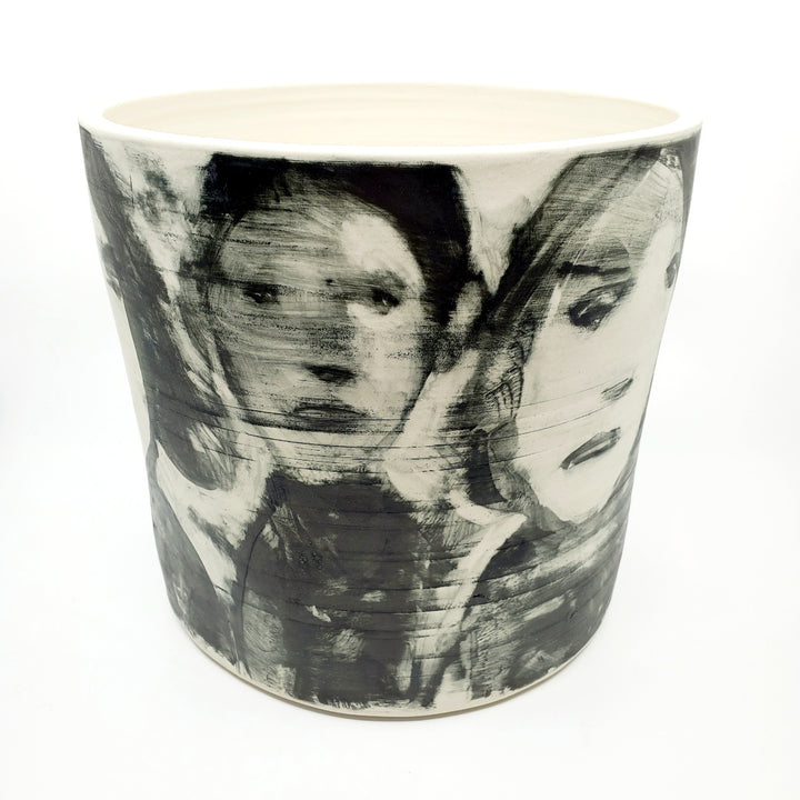 Large ceramic vessel - 2. Hand painted porcelain vessel. Black glaze has been applied in careful layers to depict faces and patterns. 25 x 25 x 23 cm.