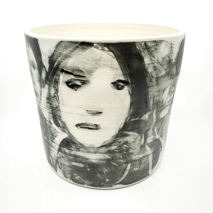 Large ceramic vessel - 2. Hand painted porcelain vessel. Black glaze has been applied in careful layers to depict faces and patterns. 25 x 25 x 23 cm.