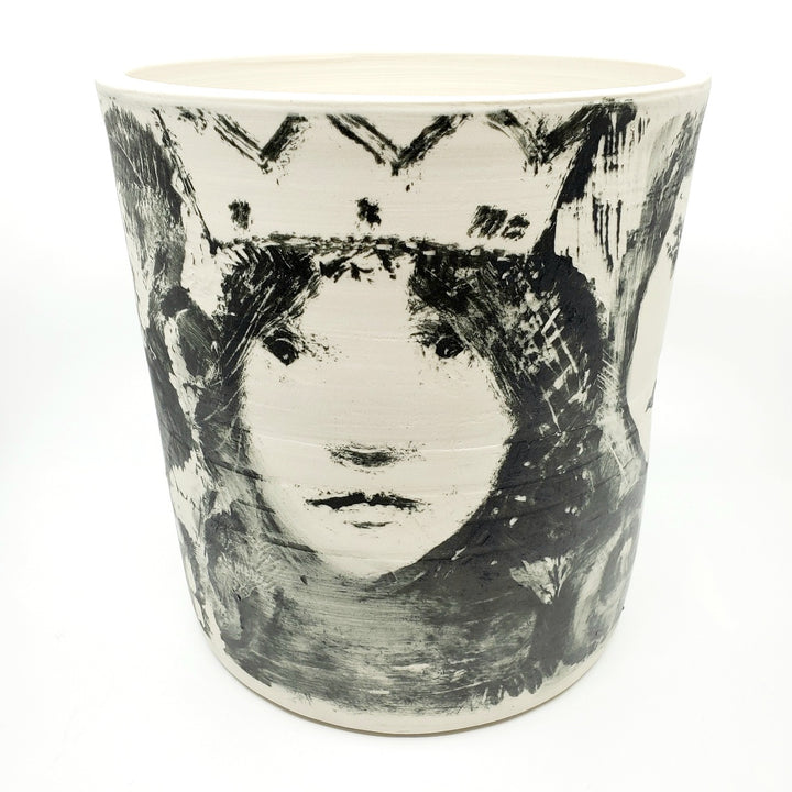 Large ceramic vessel - 1. Hand painted porcelain vessel. Black glaze has been applied in careful layers to depict faces and patterns. 23 x 23 x 25 cm.