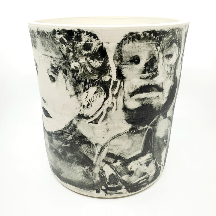 Large ceramic vessel - 1. Hand painted porcelain vessel. Black glaze has been applied in careful layers to depict faces and patterns. 23 x 23 x 25 cm.
