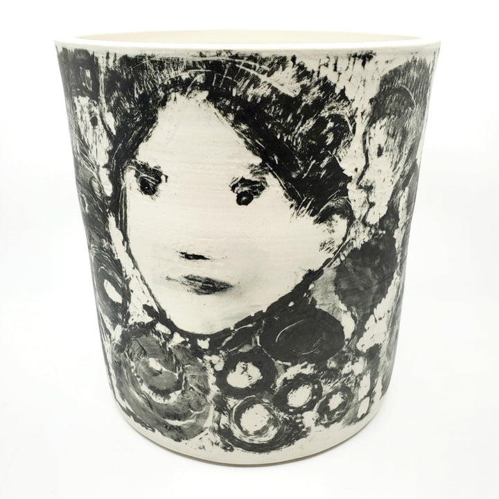 Large ceramic vessel - 1. Hand painted porcelain vessel. Black glaze has been applied in careful layers to depict faces and patterns. 23 x 23 x 25 cm.