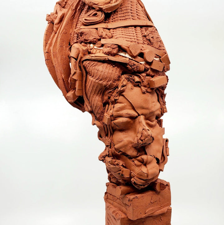 Terra Cotta Small Heads series - 3. Ceramic bust sculpture created by building up layers and layers of red clay. This bust measures 21 x 17 x 49 cm.