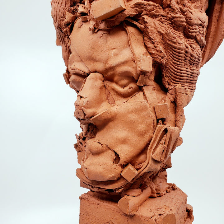 Terra Cotta Small Heads series - 3. Ceramic bust sculpture created by building up layers and layers of red clay. This bust measures 21 x 17 x 49 cm.