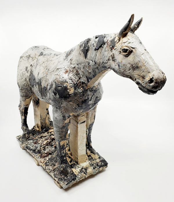 Small Gray Horse 2. The sculpture's beautiful dappled texture was achieved with layers of coloured engobes and glazes. This sturdy steed measures 40 x 10 x 30 cm.