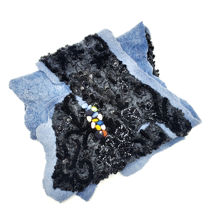 Blue scarf with black beading and buttons, created with hand-dyed silk and merino wool with recycled materials. 