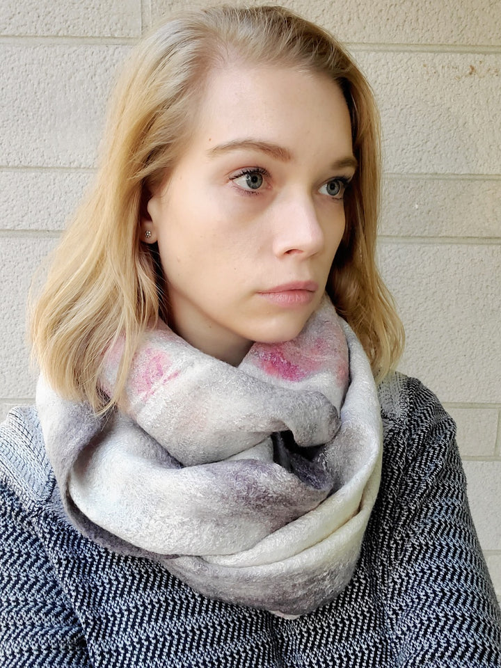 Light grey infinity scarf, created with hand-dyed silk and merino wool with recycled materials. 