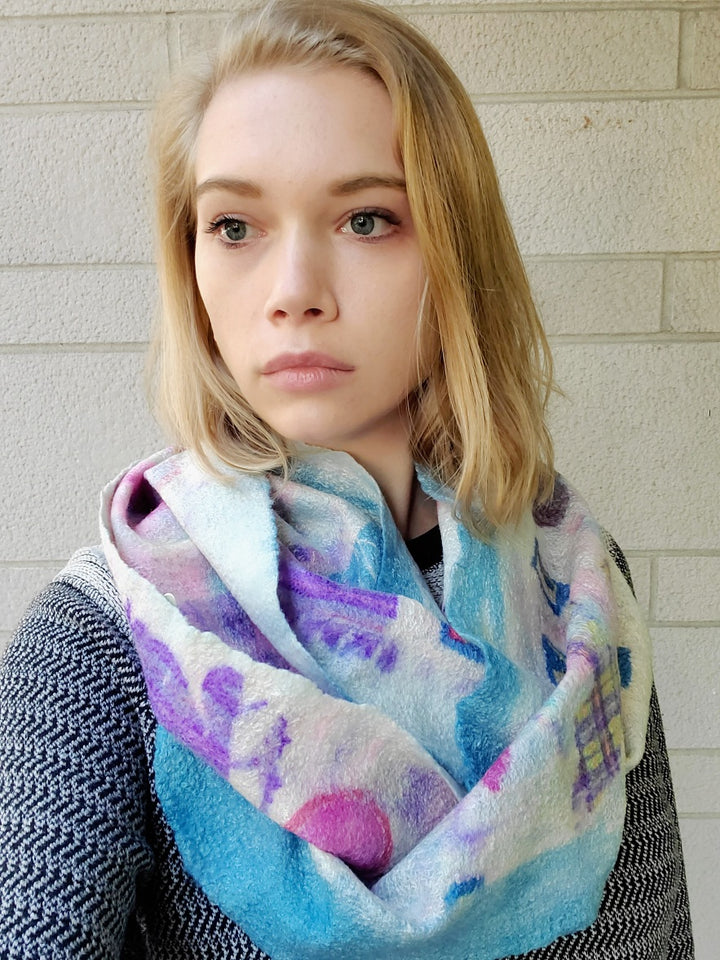 Long and delicate cowl in a childlike animals and letters design, created with hand-dyed silk and merino wool with recycled materials. Very soft to wear.