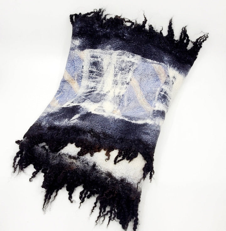 Blue and black scarf, created with hand-dyed silk and merino wool with recycled materials. 