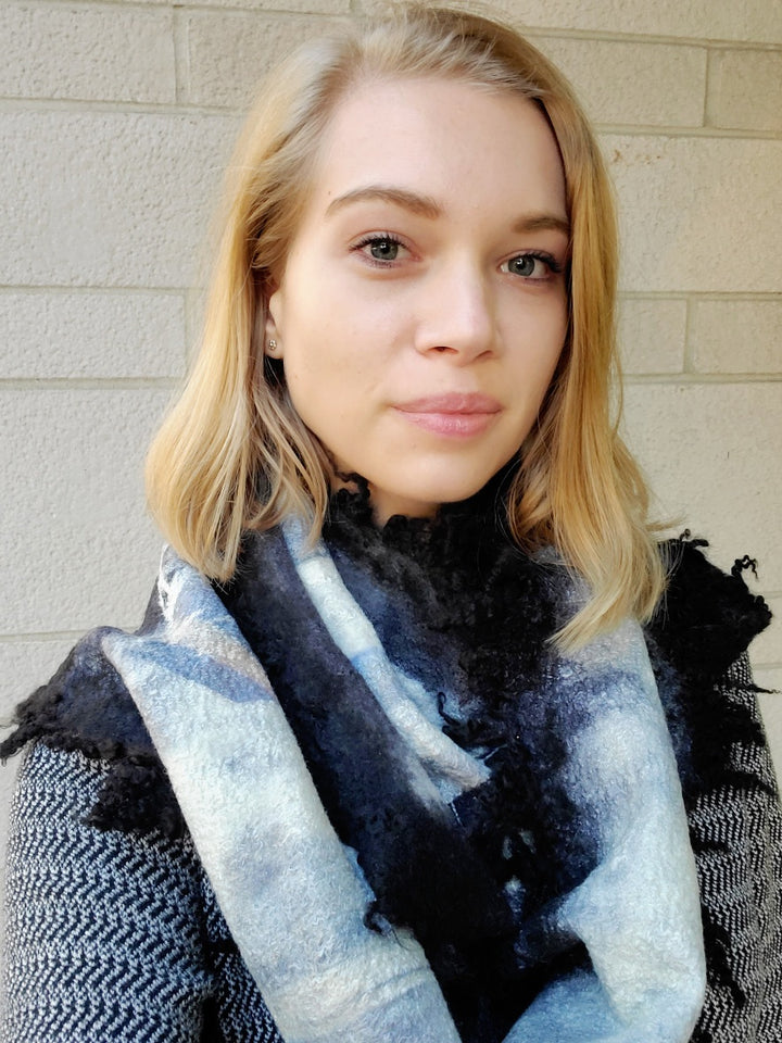Blue and black scarf, created with hand-dyed silk and merino wool with recycled materials. 