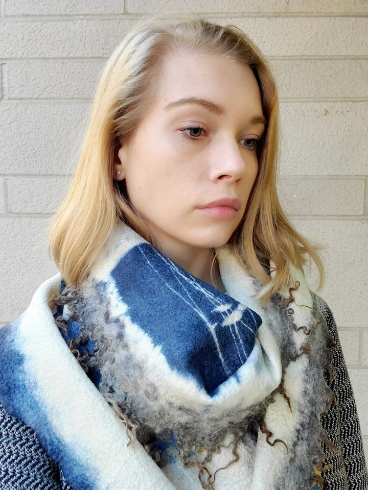 Blue and ivory scarf, created with hand-dyed silk and merino wool with recycled materials. 