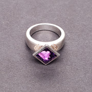 Moderna Square ring with a radiant modern fancy cut square 8mm amethyst. 