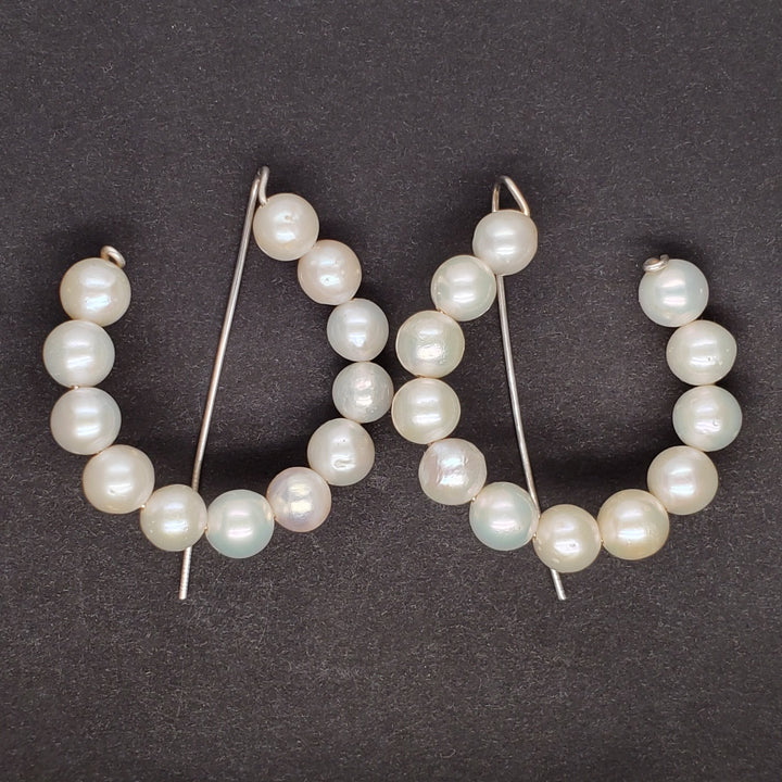 Pearl hoops, each with twelve 6mm pearls. 