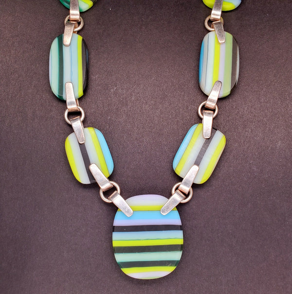 Green and blue striped glass necklace on a 20" sterling silver chain.