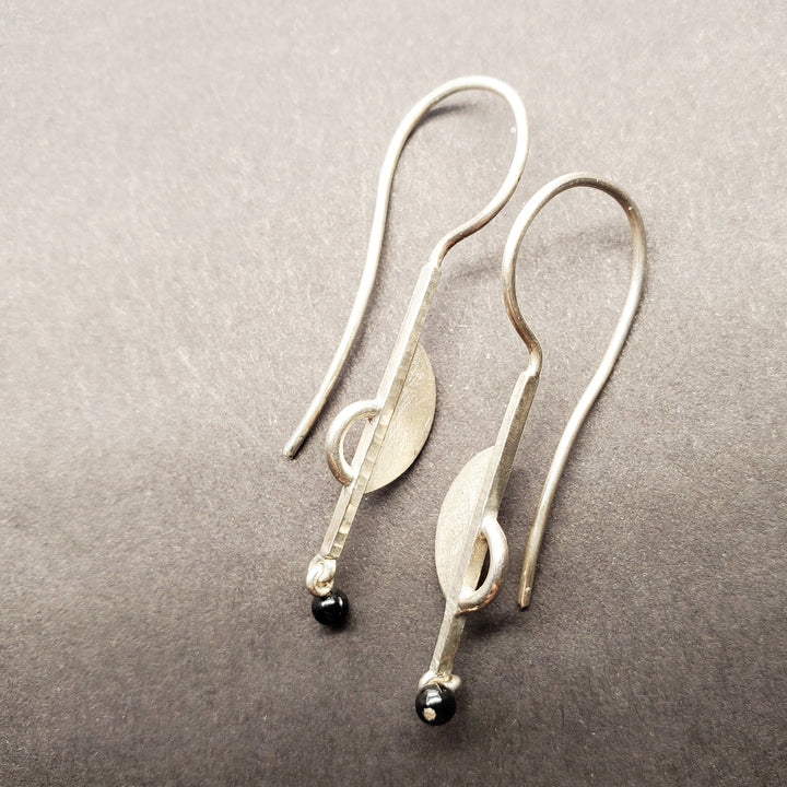 Sterling silver drop earrings featuring hematite stone