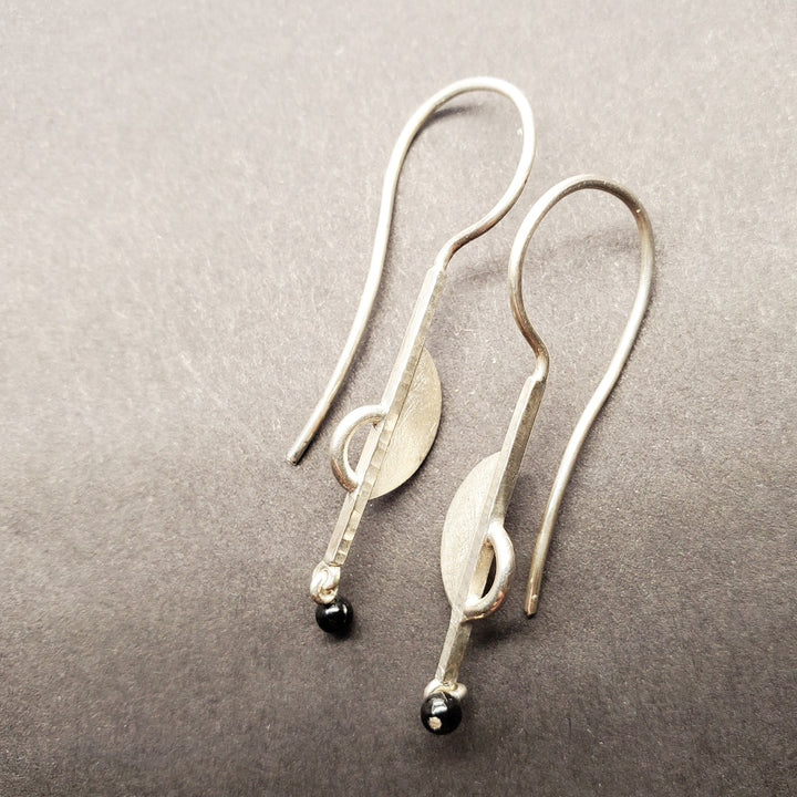 Sterling silver drop earrings featuring hematite stone