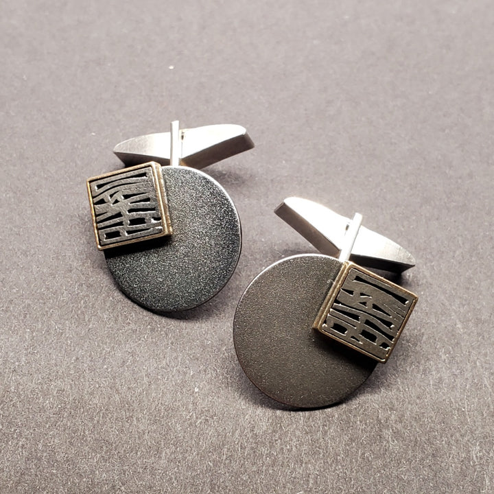 Cufflinks made from sterling silver, oxidized sterling silver, and 18k gold.