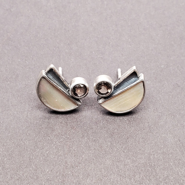 Sterling silver stud earrings made with oxidized sterling silver, smoky quartz and embellished with mother of pearl. 