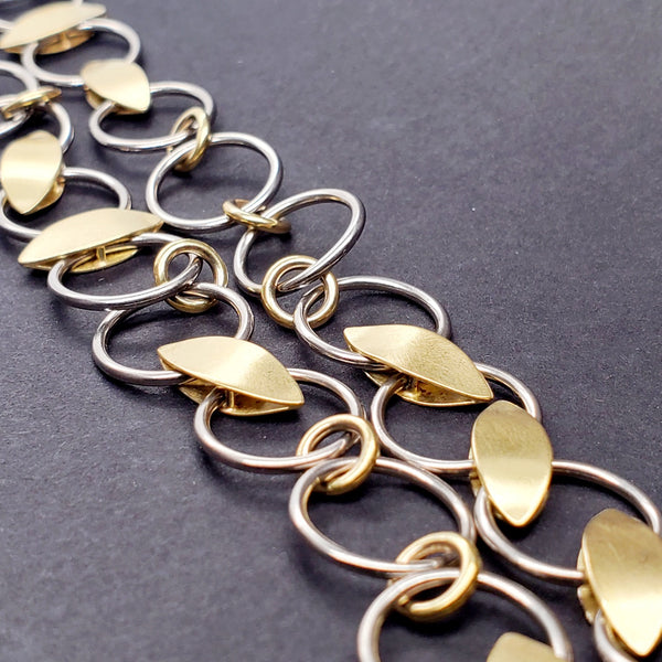 Chain link necklace made from 18K yellow gold and palladium white gold.