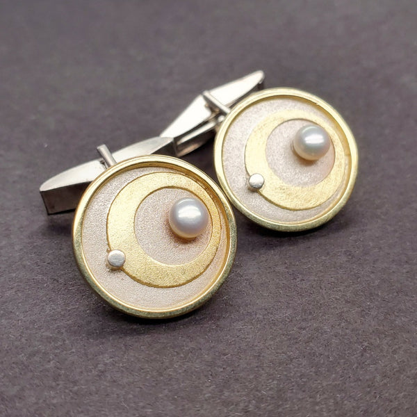 Cufflinks made from sterling silver and 18k gold, embellished with pearls.