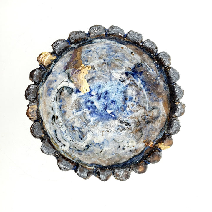 small ceramic plates and dishes: blue and gold interior