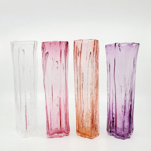 Xylem narrow vases are available in a variety of rich and vibrant colours. These hand blown glass vessels will liven up home or office and make wonderful sets. - Clear, Pink, Salmon, Amethyst