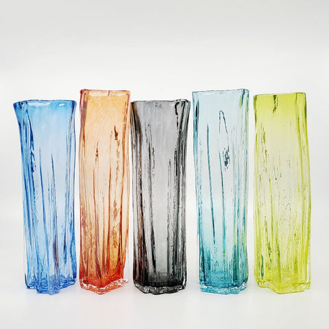 Xylem narrow vases are available in a variety of rich and vibrant colours. These hand blown glass vessels will liven up home or office and make wonderful sets. - Aqua, Red, Black, Sea green, Chartreuse