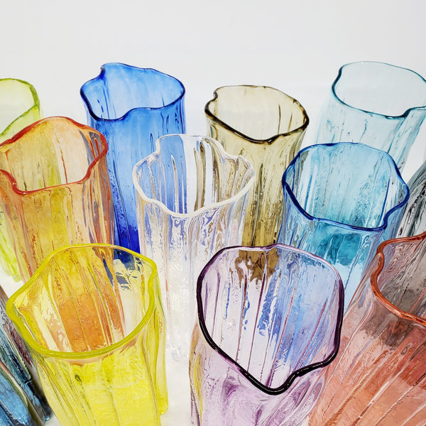 Xylem large vases are available in a variety of rich and vibrant colours. These hand blown glass vessels will liven up home or office and make wonderful sets.