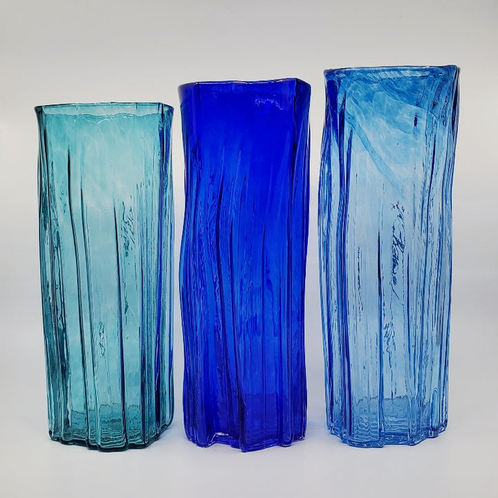 Xylem extra-large vases are available in a variety of rich and vibrant colours. These hand blown glass vessels will liven up home or office and make wonderful sets. - Dark teal, Cobalt, Aqua