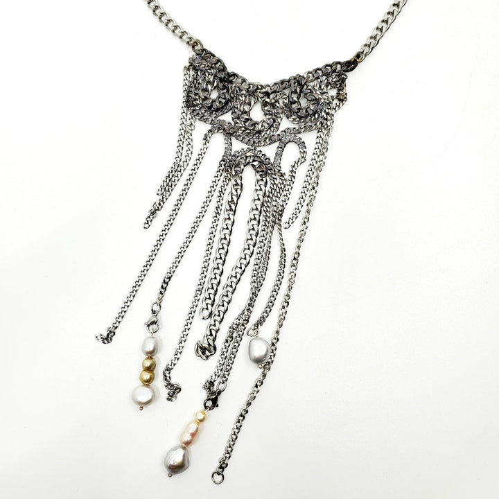 Stainless Steel Cuban Chain Necklaces are made of snake-like forms of salvaged chain. Each one is unique. 