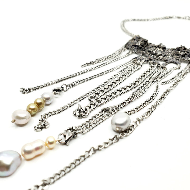 Stainless Steel Cuban Chain Necklaces are made of snake-like forms of salvaged chain. Each one is unique. 