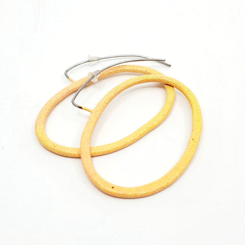 New Classic Side Hook Earrings are coloured powder-coated hoop dangle earrings.