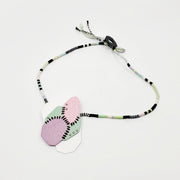 Pastel Geo Sewn Necklaces combine repurposed powder-coated copper and fibre art. The metal segments are stitched together with embroidery thread, which also winds around the cotton cord.