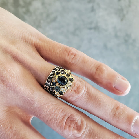 Hand stamped sterling silver ring with a bubble of stunningly coloured Montana sapphires, diamonds, and 18k gold. 