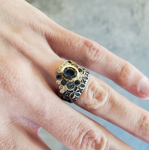 Hand stamped sterling silver ring with a bubble of stunningly coloured Montana sapphires, diamonds, and 18k gold. 